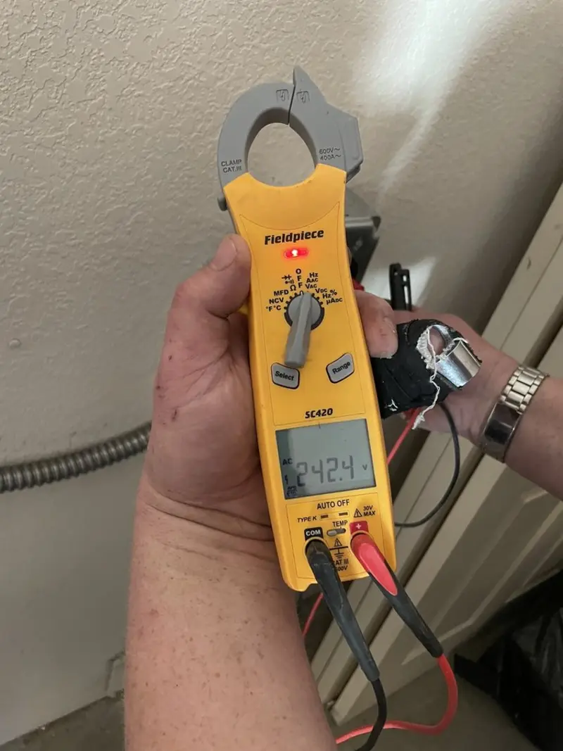 Voltage testing with clamp meter during Ceiling Fan Installation in Brookland